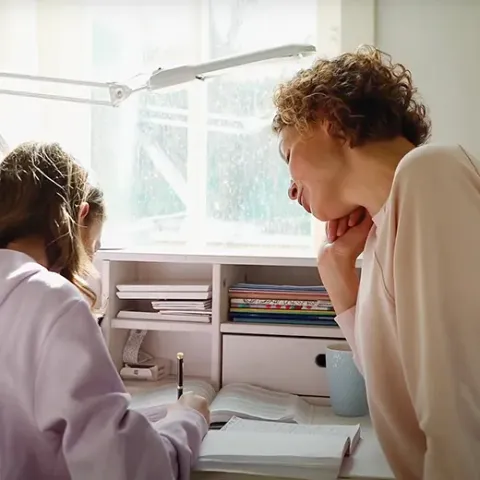 A Genius tutor working one-on-one with a student
