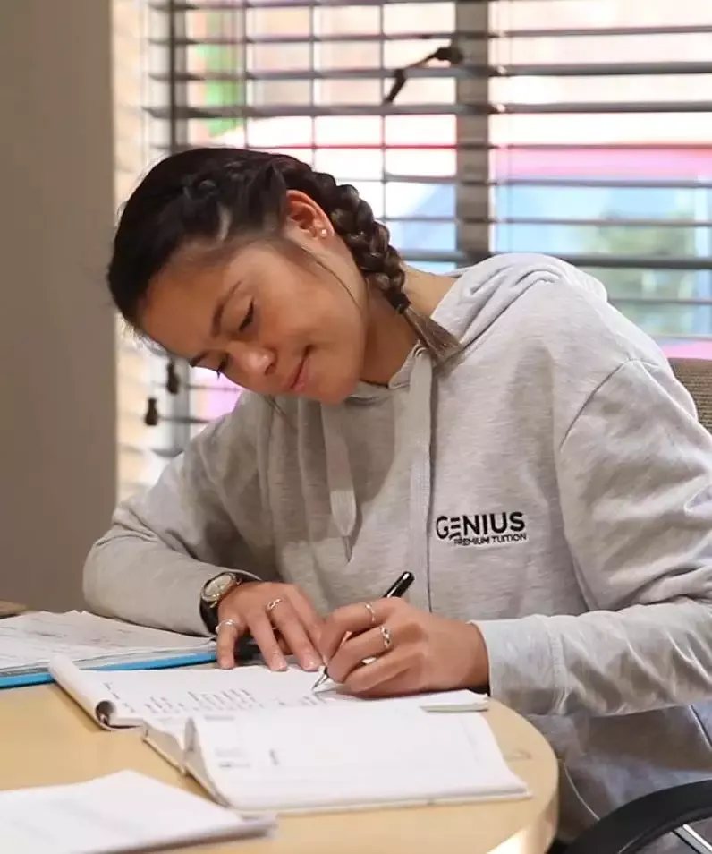 A Genius tutor working one-on-one with a student